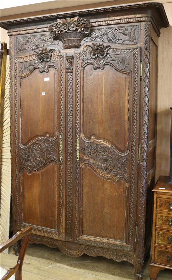 A carved oak armoire H.228cm